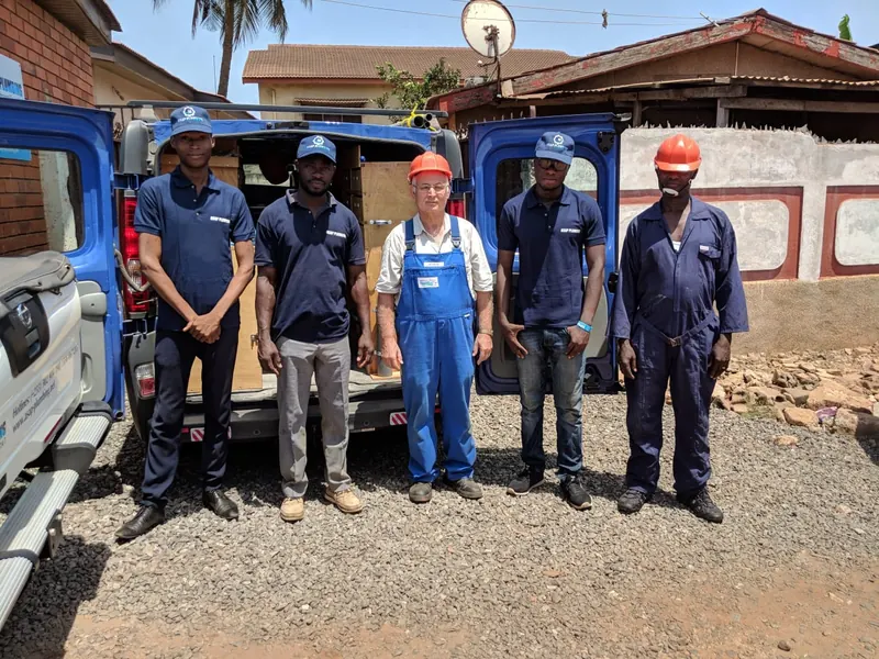 ASAP Plumbing field team standing together in front of the company van